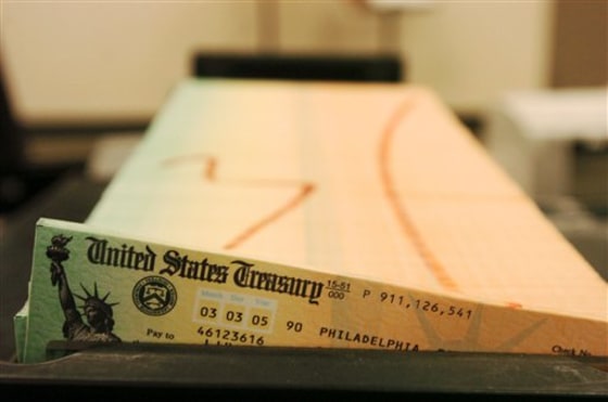Trays of printed Social Security checks waiting to be mailed from the U.S. Treasury. The government is projecting a slight cost-of-living adjustment for Social Security benefits next year, the first increase since 2009. But for most beneficiaries, rising Medicare premiums threaten to wipe out any increase in payments, leaving them without a raise for a third straight year.